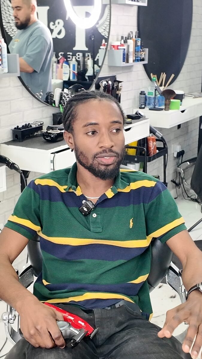 A barber at work with a Trim&Tame clipper